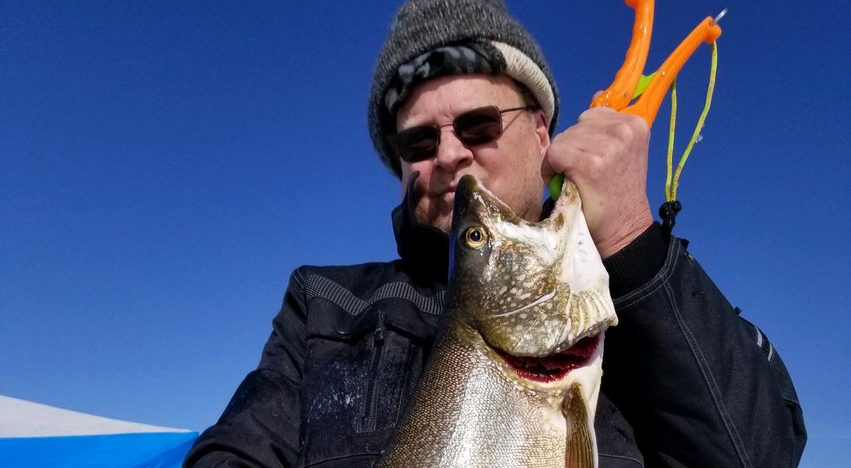 Ice Fishing Flaming Wyoming / Dutch John, Utah, United States